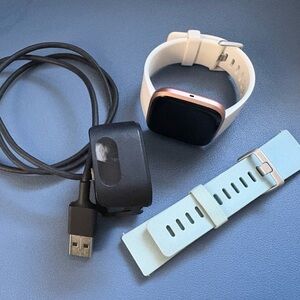 Fitbit Versa 2 Rose Gold includes charger and White and Blue Bands